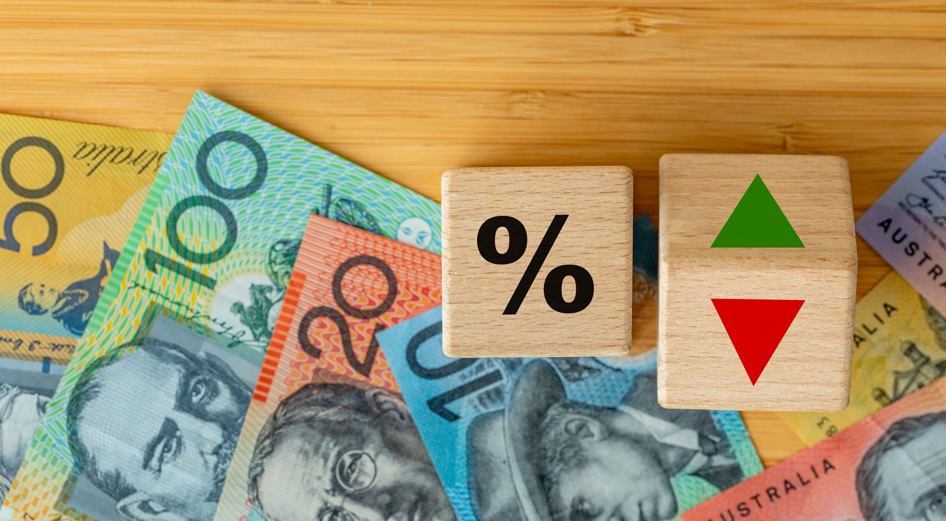 Wooden blocks with bank interest rate percent of bank with Australian dollars, Financial analysis, crisis project or economic growth concept. Australia money, close up, Flat lay background